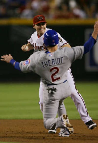 
Arizona's Stephen Drew forces out Ryan Theriot at second. Associated Press
 (Associated Press / The Spokesman-Review)
