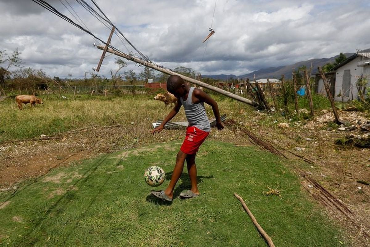 Daniel Bellet dribbles a soccer ball, after Hurricane Melissa made landfall, in Goshen in St. Elizabeth Parish, Jamaica, October 29. (Octavio Jones/Reuters)