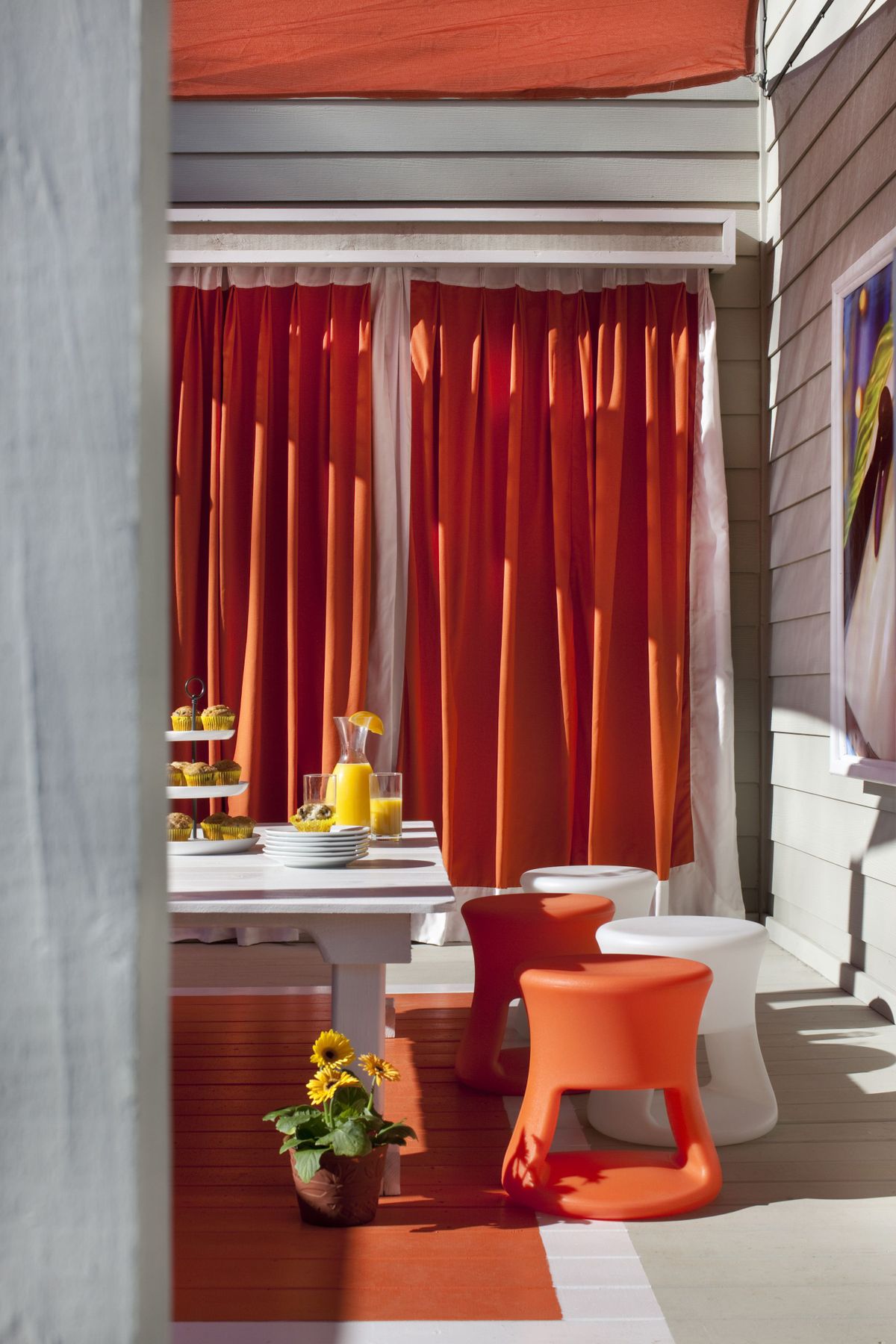 This space, also designed by Dennis Patrick Flynn, includes outdoor curtains to create privacy, bold color to add energy and a low-to-the-ground table for eight. (The Spokesman-Review)
