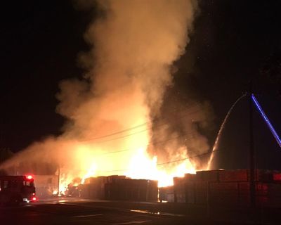 Firefighters respond to a fire outside the Fruit Packers Supply Inc. warehouse at 16th Avenue and J Street early Thursday morning (Yakima police Sgt. Ira Cavin)