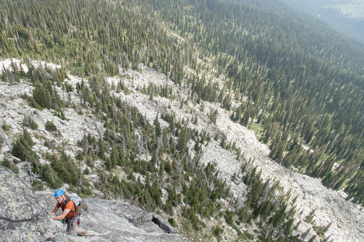 Charlie LaBrie, 58, climbs toward the summit of Harrison Peak in North Idaho on July 28. (Eli Francovich / The Spokesman-Review)