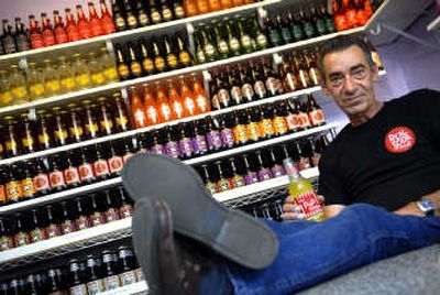 
David Dominick kicks back at his newly opened The Pop Shoppe on South Perry Street. Dominick plans on opening five more of the specialty pop stores in Spokane. 
 (Jed Conklin / The Spokesman-Review)