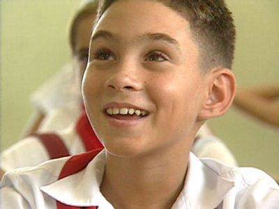 
In this image provided by CBS, Elian Gonzalez, 11, smiles in his seventh-grade classroom in Cuba. Gonzalez calls Cuban President Fidel Castro his friend.
 (Associated Press / The Spokesman-Review)