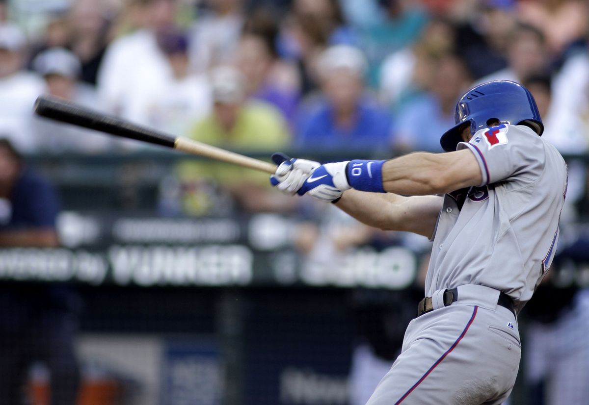 Michael Young hits a three-run homer in the third inning for Texas.  (Associated Press / The Spokesman-Review)