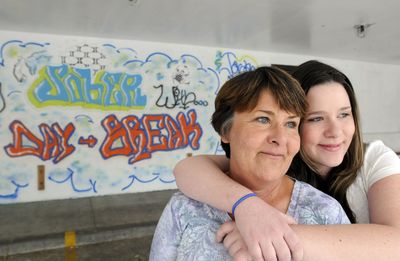 Kelsey Bartels, right, hugs her mom Trina Bartels on Sept. 20 at Daybreak, a teen drug treatment program in Spokane.  (Jesse Tinsley / The Spokesman-Review)