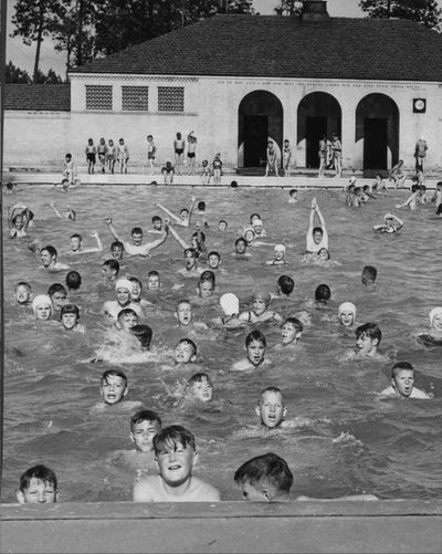 Come on in! A huge crowd of youngsters sought relief from the heat in Comstock pool. Between 2 p.m. and 3 p.m. the pool and its edges was a wriggling mass of young, wet humanity.  C.A. Chandler, pool manager, said 500 youngsters took swimming lessons at the pool before 1 p.m., and another 1,800 persons used the pool after that. 06/21/1950. Photo Archive/The Spokesman-Review. (PHOTO ARCHIVES/THE SPOKESMAN-REVIEW)