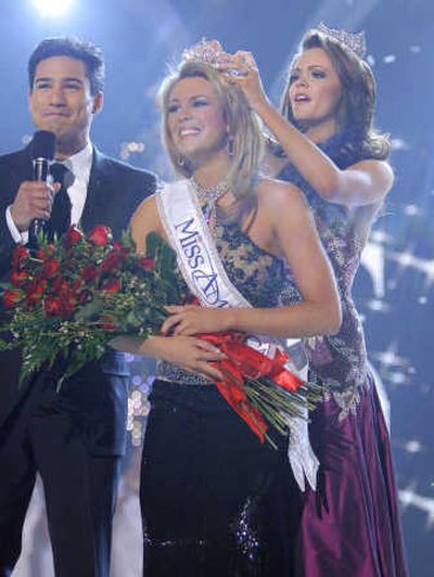 
Miss Oklahoma, Lauren Nelson, center, is crowned Miss America 2007 by Miss America 2006 Jennifer Berry at the Miss America pageant in Las Vegas, Jan. 29, 2007, with show host Mario Lopez. Associated Press
 (Associated Press / The Spokesman-Review)