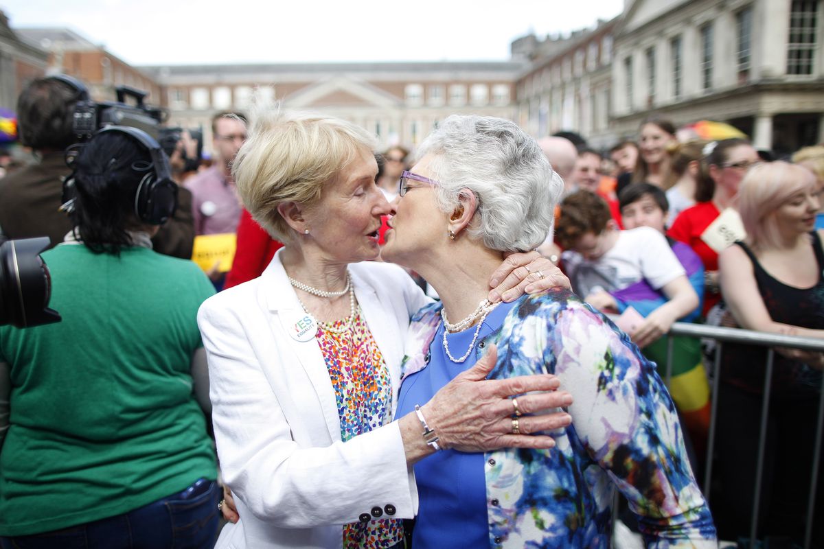 Irish Senator Katherine Zappone, right, and partner Ann Louise Gilligan celebrate as the first results in the Irish referendum start to filter through at Dublin Castle, Ireland, Saturday, May 23, 2015.  Ireland has voted resoundingly to legalize gay marriage in the world