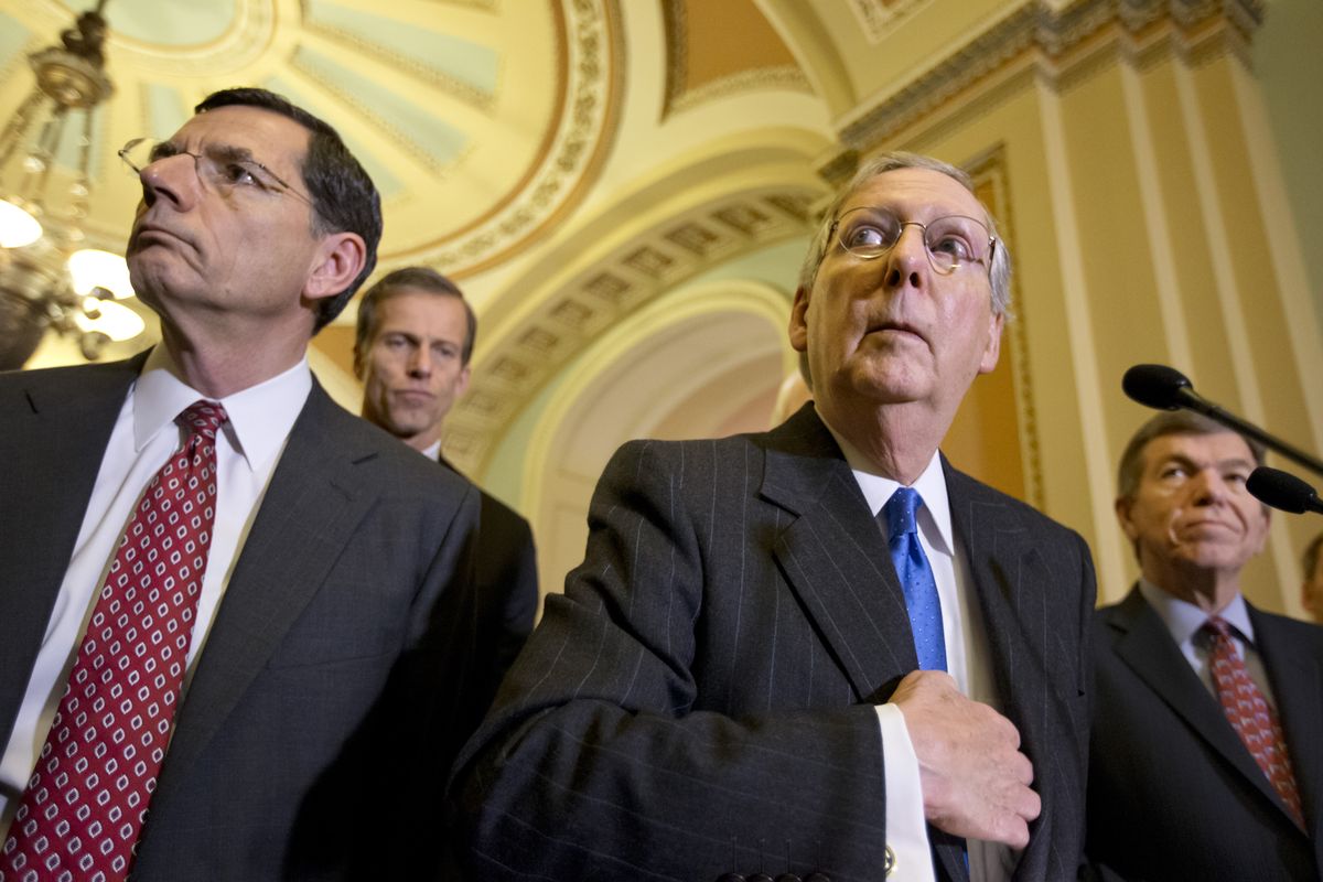 Senate Minority Leader Mitch McConnell, R-Ky., right, speaks with reporters following a GOP strategy session at the Capitol in Washington, Dec. 11, 2012, with from left, Sen. John Barrasso, R-Wyo., Sen. John Thune, R-S.D., and Sen. Roy Blunt, R-Mo. (J. Applewhite / Associated Press)