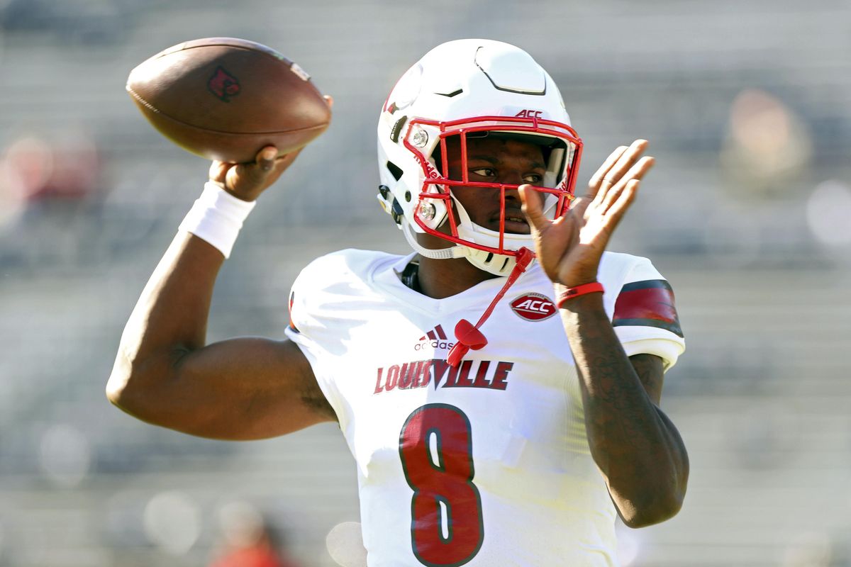 In a Saturday, Oct. 29, 2016 file photo, Louisville quarterback Lamar Jackson (8) throws a pass during warmups before an NCAA college football game against Virginia in Charlottesville, Va. (Ryan M. Kelly / Associated Press)
