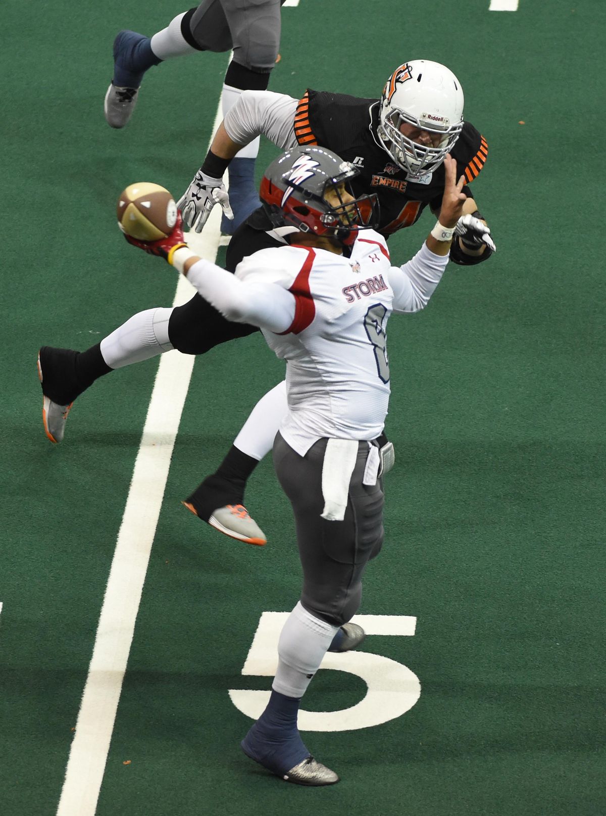 The Empire’s Brett Bowers applied pressure on Sioux Falls quarterback Lorenzo Brown when the teams met last month in Spokane. (Jesse Tinsley / The Spokesman-Review)