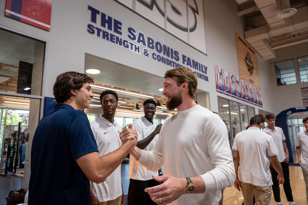 After the dedication of The Sabonis Family Strength and Conditioning Center, former Zag and current NBA player Domantas Sabonis, on right, greets Zags forward Braden Huff, Thursday inside the Volkar Center for Athletic Achievement. The strength and conditioning facility that houses Gonzaga