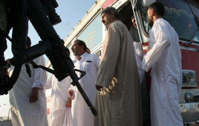 
Iraqi men held in prisons around Baghdad are released at the main bus station Sunday in Baghdad. Over 500 inmates and detainees were released. 
 (Associated Press / The Spokesman-Review)