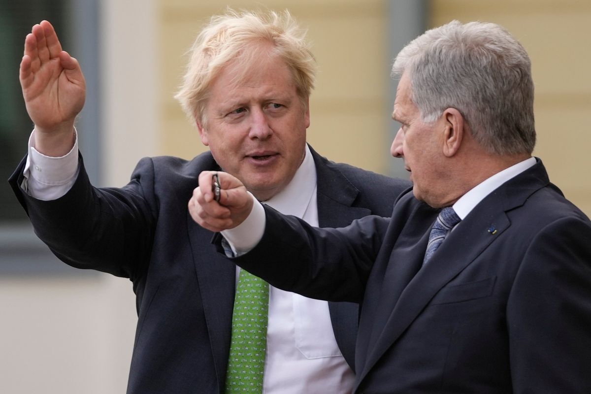British Prime Minister Boris Johnson, left, talks with Finland