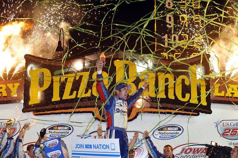 Elliott Sadler, driver of the #2 OneMain Financial Chevrolet, celebrates in victory lane after winning the U.S. Cellular 250 race at Iowa Speedway on August 4, 2012 in Newton, Iowa. (Photo by Rainier Ehrhardt/Getty Images for NASCAR) (Rainier Ehrhardt / Getty Images North America)