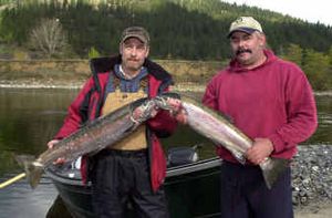 
Gregg Bingaman of Meridian, left, and Brent Gould of Nampa, right, display a pair of hatchery steelhead from the Clearwater River near Orofino, Idaho, in this October 2004 photo. 
 (Associated Press / The Spokesman-Review)