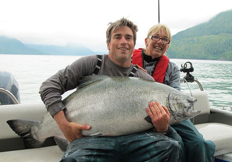 Deborah Whitman-Perry's first experience in catching a king salmon turned out to be an 83-pounder while fishing out of Good Hope Cannery Resort at Rivers Inlet, British Columbia.  The guide is Tyler Mills.  (George Cuthbert / Good Hope Cannery Ltd.)