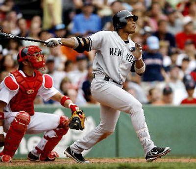 
New York Yankee's Robinson Cano admires his three-run home run on Saturday. 
 (Associated Press / The Spokesman-Review)