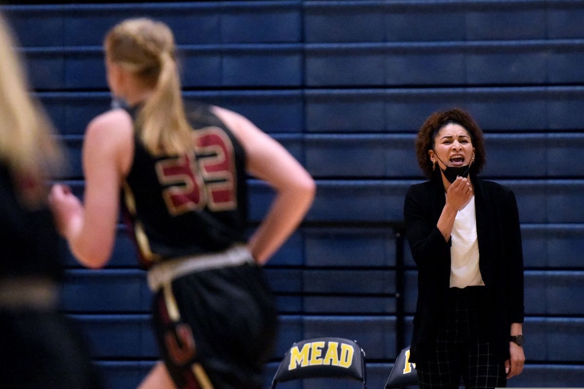 University High School girls basketball coach Jazmine Redmon coaches her team during a game against Mead on Friday, May 28, 2021.  (Kathy Plonka)