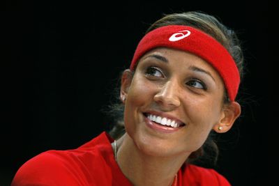 ** FILE ** In this July 14, 2008 file photo, Lolo Jones, a native of Des Moines, Iowa, smiles during an Olympic sendoff rally in Des Moines. Jones, who won the 100-meter hurdles at the U.S. Olympic trials, may compete against a racehorse at the Prairie Meadows Racetrack and Casino after competing in the Beijing Olympics. (AP Photo/Charlie Neibergall) ORG XMIT: IACN101 (Charlie Neibergall / The Spokesman-Review)