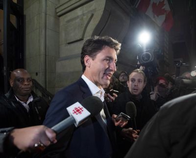 Prime Minister Justin Trudeau leaves the Office of the Prime Minister and Privy Council after an agreement was reached in the NAFTA negotiations in Ottawa, Ontario, Sunday, Sept. 30, 2018. (Justin Tang / Associated Press)