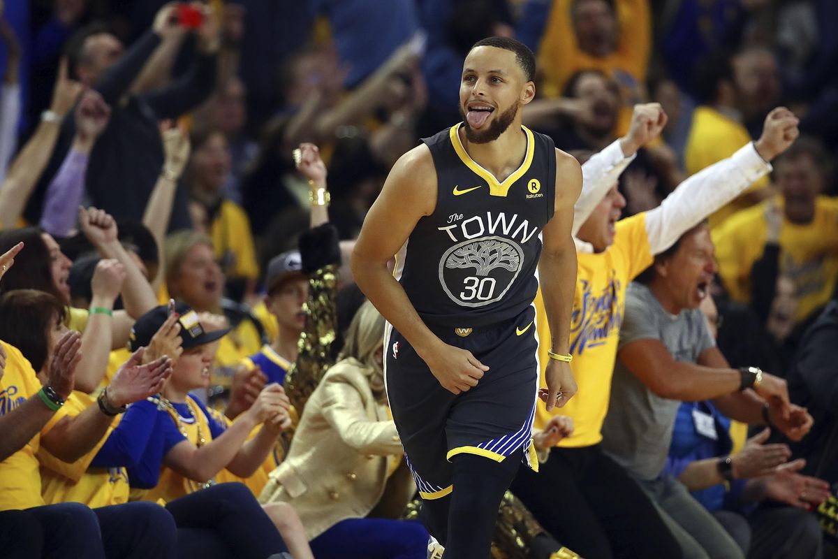 Golden State Warriors’ Stephen Curry (30) celebrates a score against the New Orleans Pelicans in the first half in Game 2 of a second-round NBA basketball playoff series Tuesday, May 1, 2018, in Oakland, Calif. (Ben Margot / Associated Press)