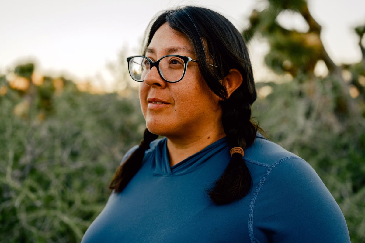 Dr. Naomi Fraga, a botanist with the nonprofit California Botanic Garden, at her campsite in Kern County, Calif., on April 28. As a Latina, Fraga is a rarity in a field long dominated by white men, dating to the 1700s when European colonists traveled the world and built collections of exotic plant specimens.  (New York Times)