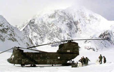 
A U.S. Army high-altitude rescue team unloads a Chinook helicopter at Mount McKinley's climbing base camp.A U.S. Army high-altitude rescue team unloads a Chinook helicopter at Mount McKinley's climbing base camp.
 (Associated PressAssociated Press / The Spokesman-Review)