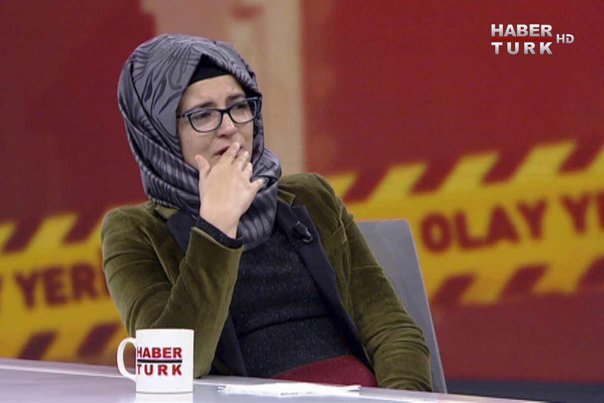 In this image from TV, Hatice Cengiz, who is Turkish, reacts during an interview on Turkish television channel HaberTurk, on Friday Oct. 26, 2018, about the day her finacee Saudi writer Jamal Khashoggi entered the Saudi Arabia Consulate on Oct. 2, and was killed inside. Hatice Cengiz said “I found myself in a darkness I cannot express”, and talked about when Khashoggi had gone to the consulate for paperwork related to his planned marriage to Cengiz. (HaberTurk / AP)