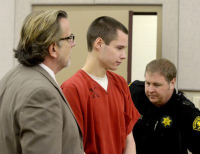 Colton Harris-Moore, in a Mount Vernon, Wash., court on Thursday with his defense lawyer. (Associated Press)