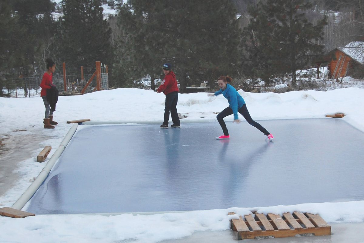 Claire Liere, right, and her brother, Walker, and Joanna Cox, left, learn ice is the best distraction from cell phones and video games.