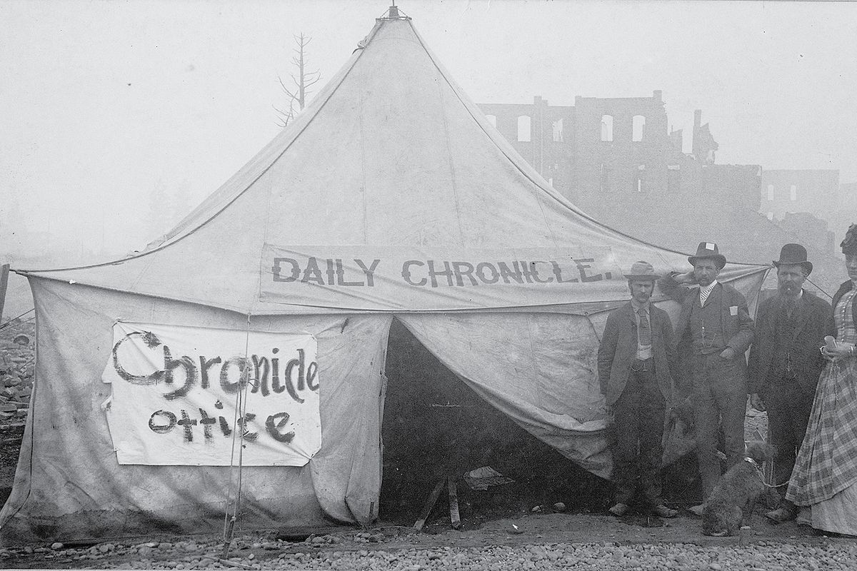 The Spokane Daily Chronicle staff stands next to their temporary quarters after the Great Fire of 1889. (Eastern Washington State Historical Society )