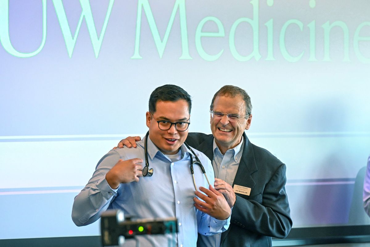 University of Washington School of Medicine student Diego Delgadillo and Dr. John McCarthy are all smiles after McCarthy presented Wallace with a stethoscope during a welcoming ceremony to mark the beginning of training to become future physicians Thursday in Spokane. Some 61 students are part of the incoming class.  (DAN PELLE/THE SPOKESMAN-REVIEW)