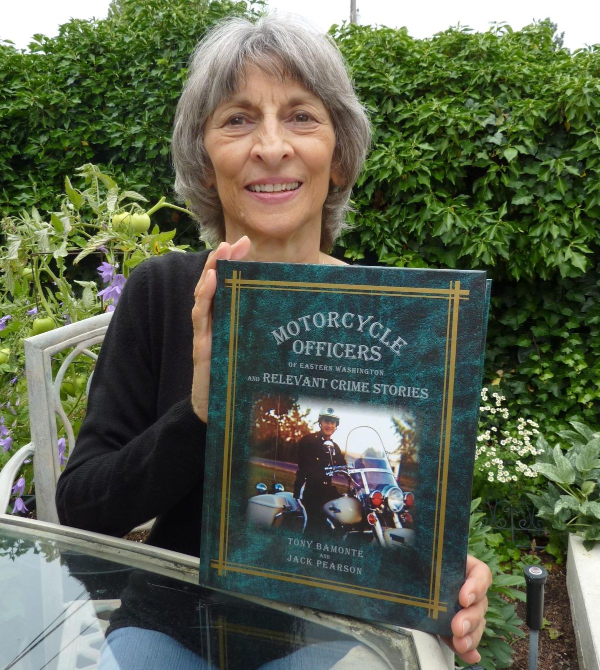 Suzanne Bamonte holds the book her husband, Tony Bamonte, was most proud of writing, “Motorcycle Officers of Eastern Washington and Relevant Crime Stories.” (Courtesy photo)