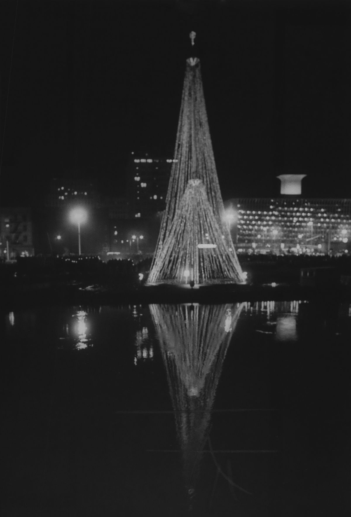 1973: Expo ’74’s environmental Christmas tree was lit on Dec. 20, 1973, in a dedication ceremony with actor Marvin Miller as master of ceremonies and narrator. The tree, rising 120 feet above the world’s fair site, was strung with wires and hung with about 40,000 recyclable aluminum cans. A mass choir of 500 singers and more than 800 spectators attended the dedication on the future site of the Ford Motor Company pavilion.  (Jim Shelton/The Spokesman-Review)