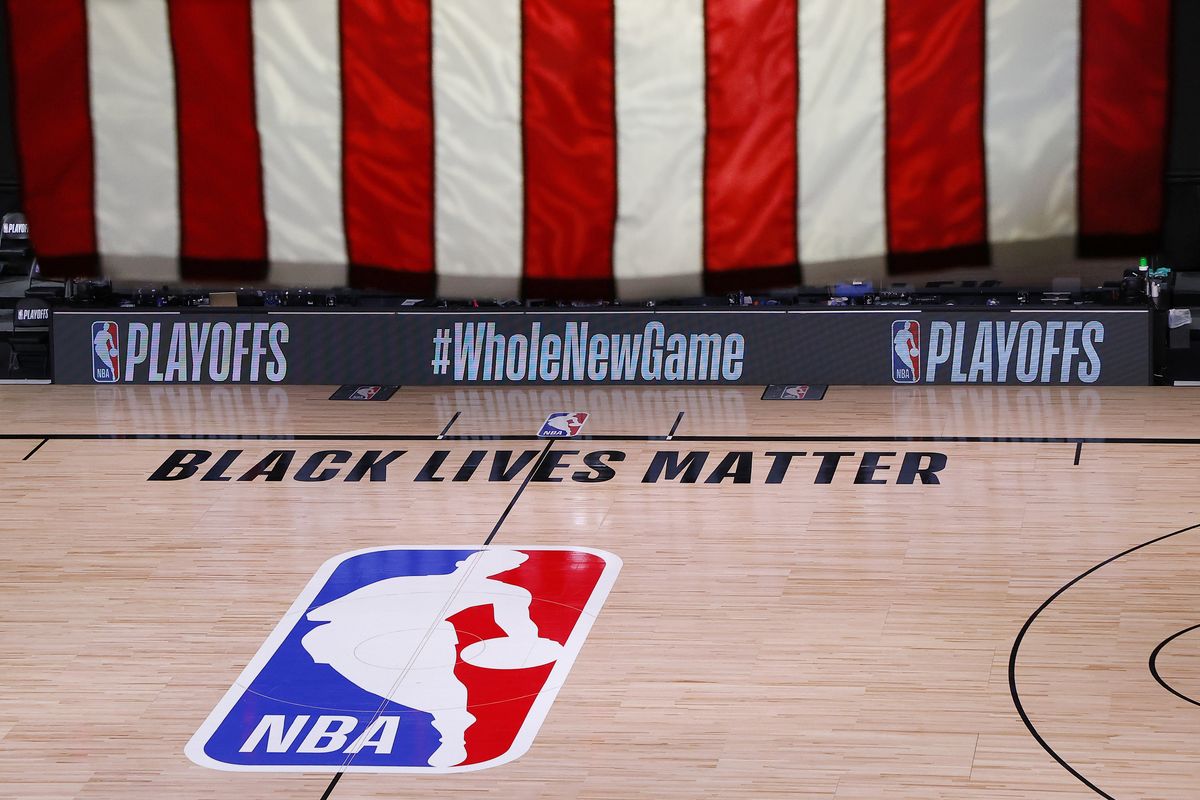 An empty court and bench are shown following the scheduled start time of an NBA game on Wednesday. Thursday marked a second day with no games.  (Kevin C. Cox/Associated Press)