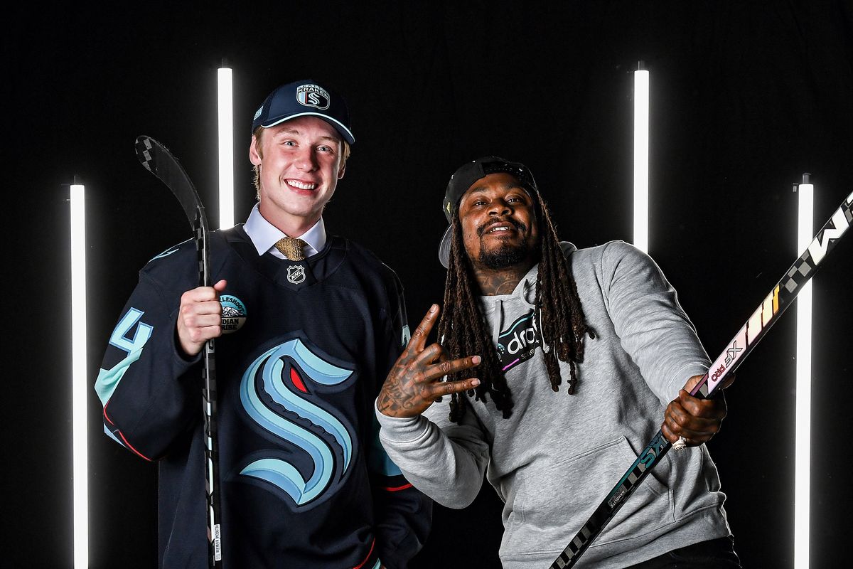 Berkly Catton poses for a portrait with Marshawn Lynch after being drafted Friday by the Seattle Kraken with the eighth overall pick during the 2024 NHL draft in Las Vegas.  (Getty Images)