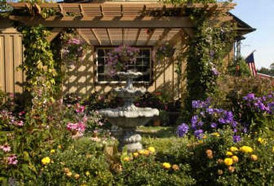 
Dan and Kay Loibl's Spokane Valley home is enriched with color from the spectacular gardens on their property.
 (The Spokesman-Review)