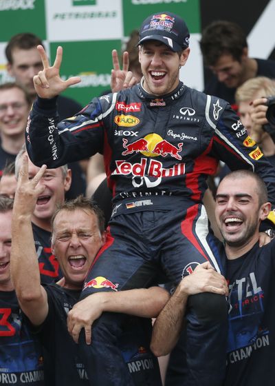 At 25, Red Bull driver Sebastian Vettel became the youngest driver to win three Formula One championships. (Associated Press)