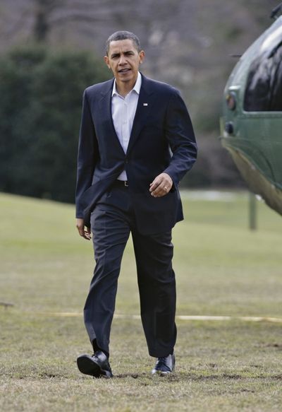 President Barack Obama  returns  from a medical exam Sunday.  (Associated Press)
