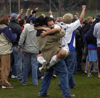 
Josh Greenleaf gets a victory hug after Whitworth beat Trinity in overtime on Sunday.
 (Liz Kishimoto / The Spokesman-Review)