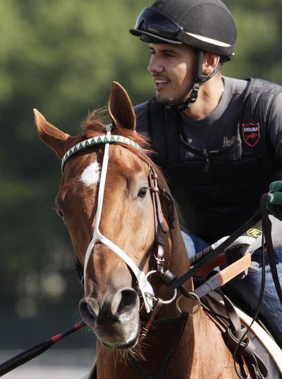I'll Have Another, with exercise rider Jonny Garcia up, trains at Belmont Park, Wednesday, in Elmont, N.Y. The winner of the Kentucky Derby and Preakness will attempt to win the Belmont Stakes and Triple Crown on Saturday. (Associated Press)