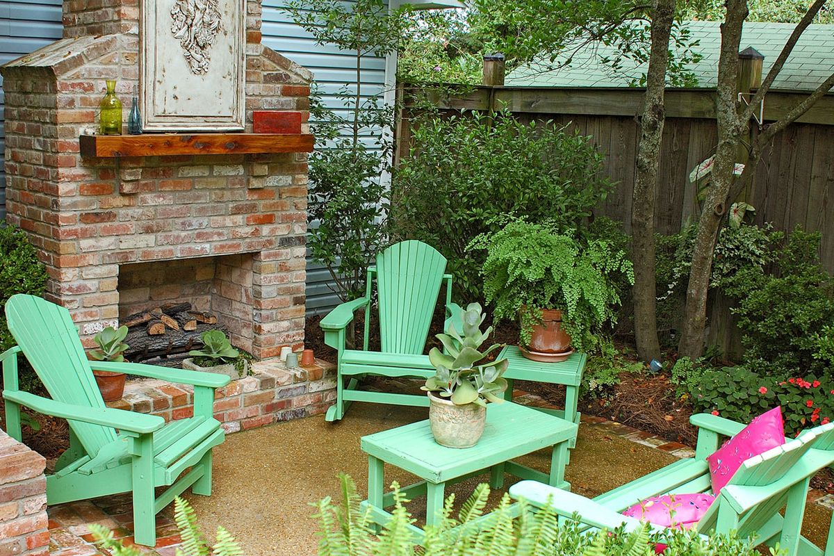 This outdoor fireplace with Adirondack-style chairs, matching coffee table, end table and loveseat creates a area that is soothing and inviting on cooler days. McClatchy-Tribune (McClatchy-Tribune)