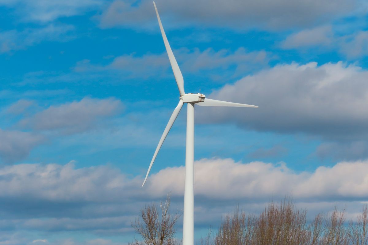 This Feb. 18, 2022 photo shows a land-based windmill in Atlantic City N.J. that helps power a sewage treatment plant. The second day of the largest-ever auction of offshore wind energy sites in the U.S. is being held, Thursday, Feb. 24, with strong interest from companies wanting to build wind turbines in the ocean off New Jersey and New York.  (Wayne Parry)
