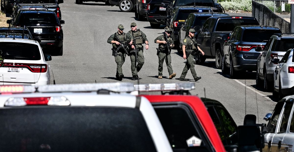 Police and fire crews respond to a shooting and fire on Canfield Mountain in Coeur d’Alene on Sunday, June 29, 2025. The shooting killed two firefighters in an “ambush-style” attack. (Kathy Plonka/The Spokesman-Review)