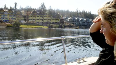 Gozzer Ranch marketing manager Erin Dixon checks out progress on new condos at Gozzer Ranch, a gated lakeside community. Developer Discovery Land Co. says sales are OK despite the economic downturn. (Photos by KATHY PLONKA / The Spokesman-Review)