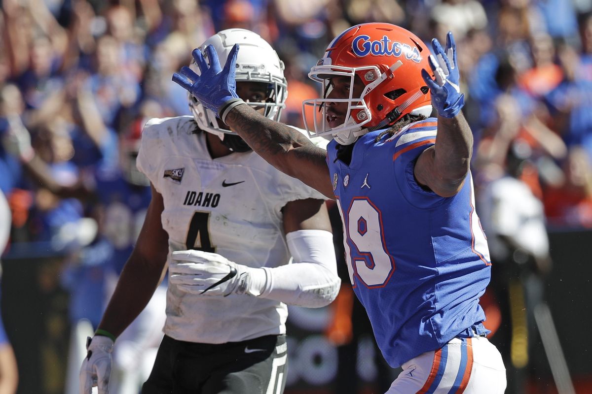 Florida wide receiver Tyrie Cleveland celebrates after catching a 34-yard touchdown pass in front of Idaho defensive back Denzal Brantley during the first half  Saturday in Gainesville, Fla. (John Raoux / AP)