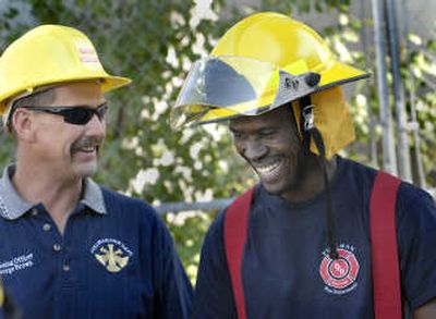 
Ahmad Kamara shares a laugh with George Brown, Pullman firefighter training officer, during a Friday tour of WSU's Martin Stadium. The Spokesman-Revew
 (Brian Plonka The Spokesman-Revew / The Spokesman-Review)