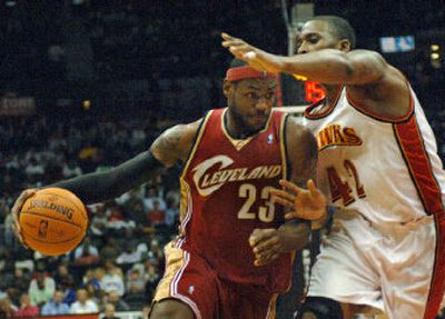 
Cleveland Cavaliers forward LeBron James drives against Atlanta Hawks forward Lorenzen Wright on Wednesday.
 (Associated Press / The Spokesman-Review)