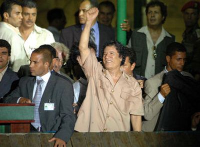 
Libyan leader Moammar Gadhafi gestures in Martyr's Square in Tripoli, Libya, Wednesday at an annual celebration  marking the coup that brought him to power.
 (Associated Press / The Spokesman-Review)
